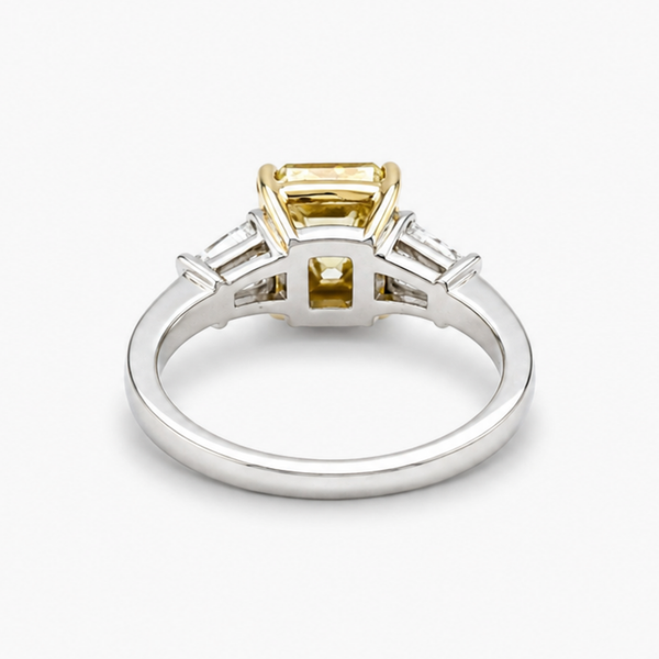 Radiant Cut Fancy Yellow Diamond Three-Stone Ring with Tapered Baguette Sidestones, 2.01 CT